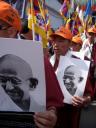 Core Marchers departing on the March to Tibet carry photos of the Dalai Lama and Gandhi.