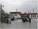 Cars overturned in front of the Jokhang in Lhasa