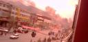 Smoke rises over the streets of Lhasa as police clash with protesters